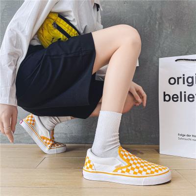 China Cushioning Korean version of plaid canvas shoes one-pedal shoes student base plate black and white female casual lazy flat couples shoes for sale