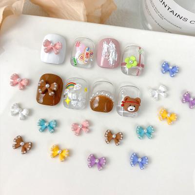 China Easy Apply 2022 Alloy Nail Charm Cute Pearl Bow 3d Nail Art Frosted Ribbon 3d Nail Accessories for sale