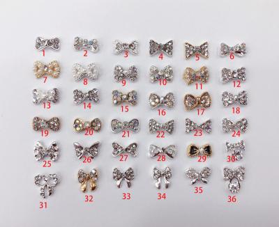 China Easy Apply Shandie Bowknot Alloy Rhinestone Pearl Nail Decoration 3d Nail Art Accessories for sale