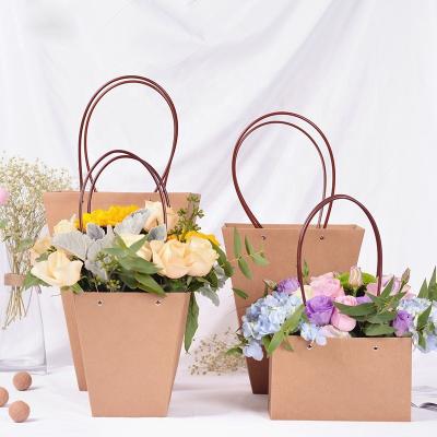 China SEEWIN Handmade Wholesale Brown Waterproof Paper Flower Bag Bouquet Small Packaging Bag With Flat Handle for sale