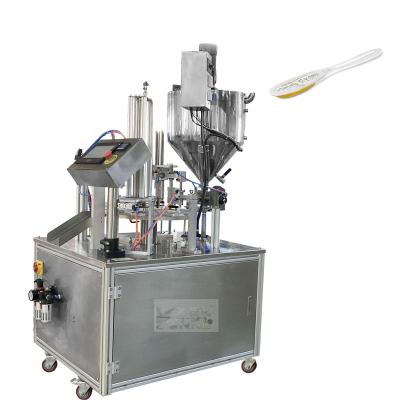 China Automatic Food Honey Spoon Packaging Machine Filling And Sealing Machine for sale