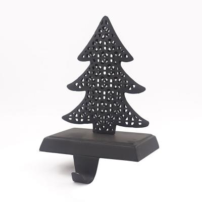 China Wholesale Popular Christmas Decoration Gift Hollow Tree Star Stocking Holder Decorator Black Christmas Ornaments For Customize for sale