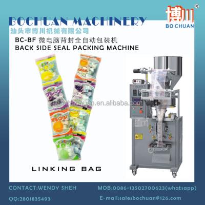 China CANDY NUT SEED CANDY BACK SEAL PACKING MACHINE VERTICAL PELLET VFFS en venta