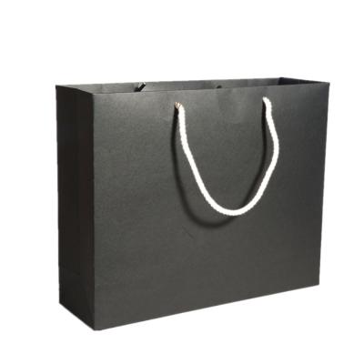 China Disposable High Quality Black Cardboard Gift Bags Fashion Shopping Paper Carry Bags for sale