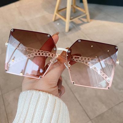 China 2022 Fashion Designer Brand Sun Glasses Fashion Ladies Sun Glasses Large Hollow Chain Frame Flat Top Rivet Sunglasses Shape Outdoor Sun Glasses for sale