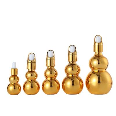 China Skin care cream in stock 10/20/30/50/100ml plated gourd gold dropper bottle essential oil bottle for sale