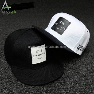 China COMMON Custom Flat Brim Structured Embroidery And Printed Snapback Hats Wholesale 5 Panel Snapback Hats With Leather Patch for sale