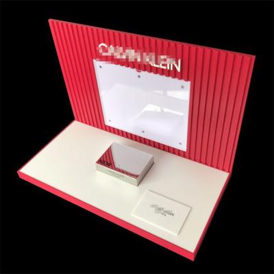 China Custom Clear Logo Acrylic Racks Display Clear Cosmetic Display Stand for Retail Stores for sale