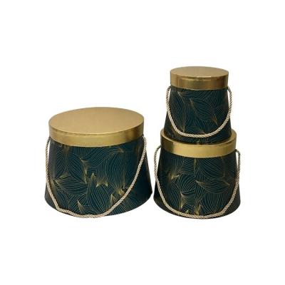 China Round cone shaped gift box of handmade processThree-piece gilt flower tan for sale