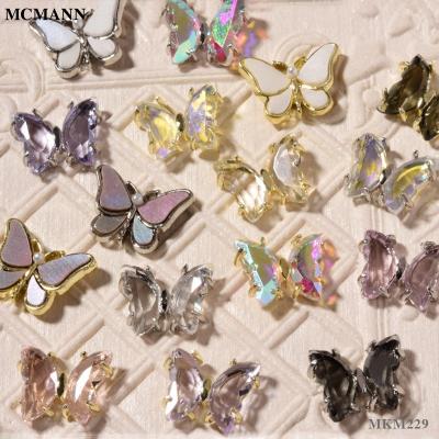 China Bestselling Zircon Crystal Butterfly Metal McMann Nail Metal Shell Cat Eye Stone Alloy Rhinestone Translucent Ornament for sale