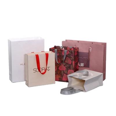 China Custom White Cheap Clothing Shopping Paper Bags Pantone Gift OEM Customized Paper Bag for sale