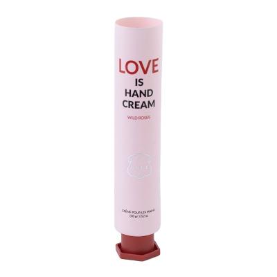 China Round tube cosmetic plastic tube colored 100ml hand cream tube packaging with hexagonal cover for sale