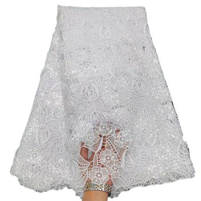 China Full eyelet fabric viable fashionable fabric bleached white dress water soluble embroidery hollow out milk lace silk knitting garment for sale