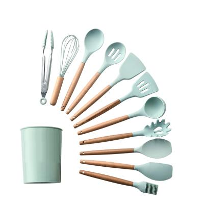 China Amazon Sustainable Hot Selling Wooden Handle 12 Piece Silicone Kitchen Utensil Set With Storage Bucket for sale