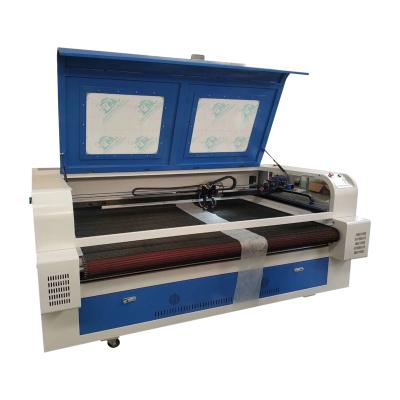 China Laser CUTTING Type Carpet T-Shirts Textile Fabric 60W Automatic Feeding Laser CO2 Laser Cutting Machine 1610 for sale