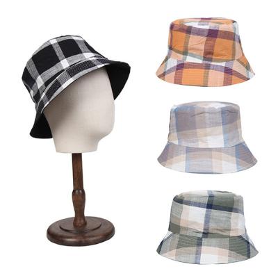 China Bucket hats wholesale men fisherman travel essential simple sunscreen printed plaid double sided hat for sale