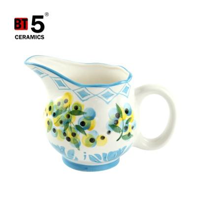 China Sustainable Hand Painted Ceramic Flower Milk Jugs Creamer With Handle for sale