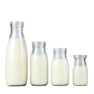 China Food Wholesale Milk Bottle Drinking Glass Bottle Transparent 500ml Glass Beverage Bottle for sale