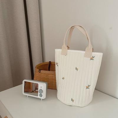 China 2022 New Style Reusable INS Fashion Cute Embroidered Baby Bottle Diaper Storage Hanging Bag for sale