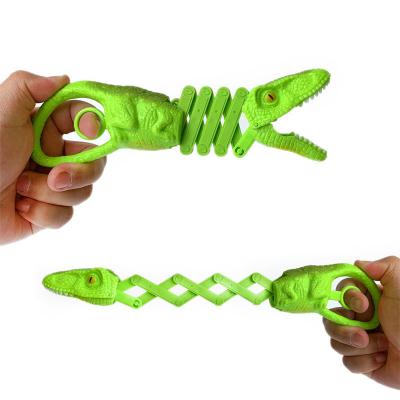 China Manipulator Retractable Clip PVC Novelty Dinosaur Spring Bite Tricky Toy Animal Character Game Fidget Toys for sale