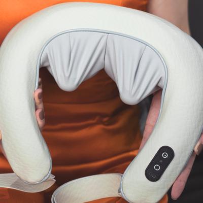 China 2023 Comfortable EMS neck massage pillow multiple rechargeable neckology bluetooth smart smart neck massager for sale