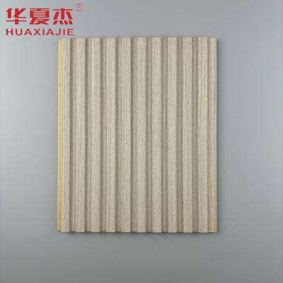 China Best verkopende houtgraan wpc wandpaneel gevlochten pvc-paneel wpc waterdicht wandpaneel voor interieurdecoratie Te koop