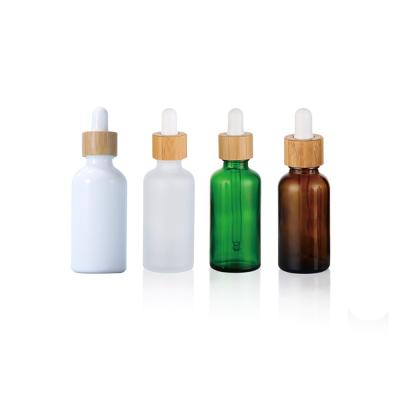 China Fancy Unique Luxury 10 20ml 30Ml 50Ml Personal Care 60ml 120ml Essential Oil Dropper Glass Bottle With Wooden Lid Bamboo Wood Cap for sale