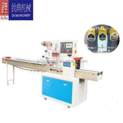 China Small Chemical Bag Socks Flow Packing Machine for sale