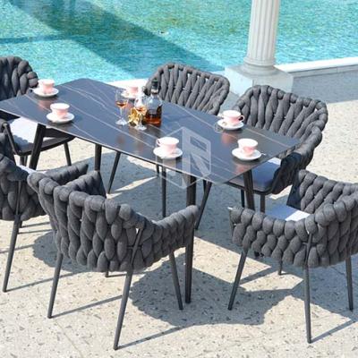 China Modern Hot Sale Outdoor Garden Wicker Dining Furniture and Rock Slab Table and Teslin Fabric Chair Sets for sale