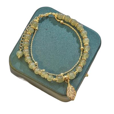 China Fashion eco-friendly lead free valentine branch jade leaf gold bracelets imitate string natural stone charm bead jade beaded bracelet for sale