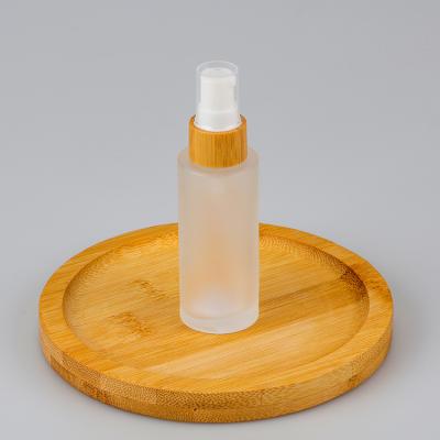 China Personal Care 15ml 30ml 50ml 100ml 150ml Cylinder Empty Cosmetic Shape Bottles Frosted Glass Lotion Spray Bottle With Bamboo Collar Lid for sale