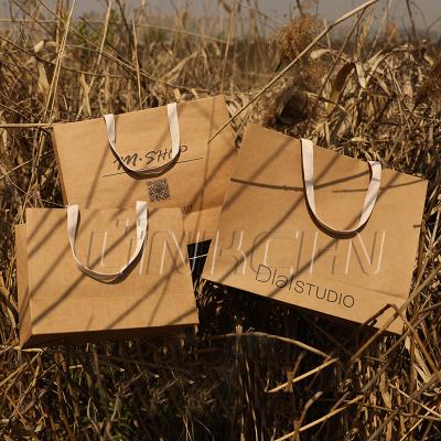 China Disposable Wholesale Custom Brown Kraft Paper Gift Bags With Ribbon for sale