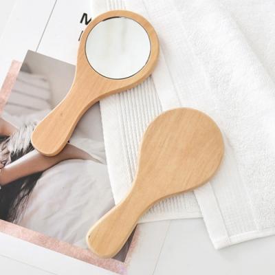 China 2022 Non-specific New Arrive Customs Logo Round Handle Wood Mirror Portable Makeup Tool Pocket Mirror for sale