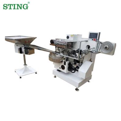 China Small food golden coin around egg ball wrap chocolate foil wrapping machine price for sale for sale