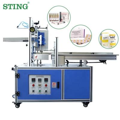 China Pocket horizontal semi automatic syringe face mask tube ointment food medicine cartoning machine for sale