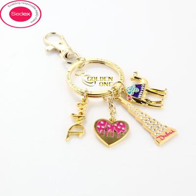 China Low Price Accessories Enamel Keyring Shiny Gold Plated add Fake Diamond Letter Heart shape Burj Khalifa Tower Souvenir Keychain for sale