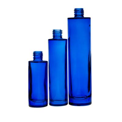 China 50ml Blue Glass Perfume Bottles Cylinder Transparent Popular Design Perfume Glass Bottle for sale