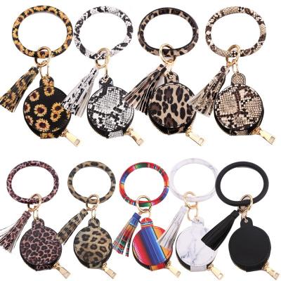 China Waterproof Multi-Color Leather Wristband Bracelet Wristband Tassel Keychain Bag Earphone PU Key Chain for sale