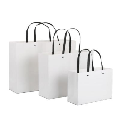 China Recyclable Wholesale White Color Paper Bag Handle Kraft Paper Bags Shopping Packaging For Gift for sale