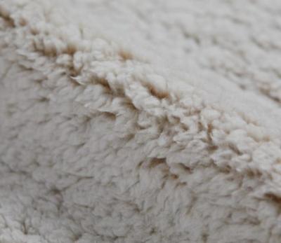 China Auto Upholstery Knitted Flannel Fleece Faux Fur Fabrics Color White Double Sides Auto Textile Home Garment Upholstery Toy for sale