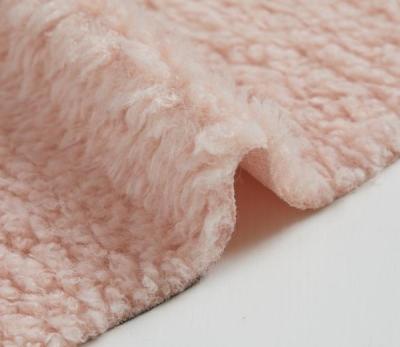 China Cheap faux fur fabrics pink color pink color upholstery fur fabric wholesale automatic curly artificial fur fabric for sale