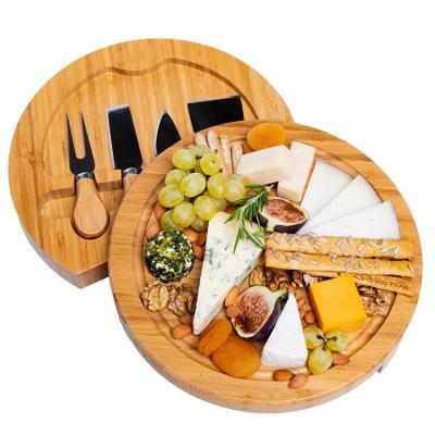 China Sustainable Bamboo Round Charcuterie Boards Cheese Board and Knife Set Meat Tray with 4 Knife Cheese Cutting Board Set for sale