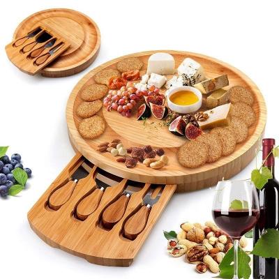 China Charcuterie Tray Sustainable Kitchen Round Bamboo Revolving Cheese Board Set With Drawer And Knives for sale