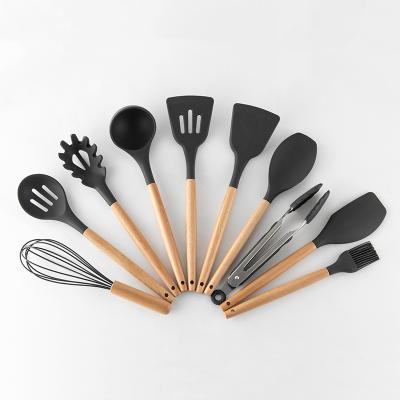 China Sustainable Food Grade Cookware 11PCS Wooden Handle Kitchen Utensil Set Silicone for sale