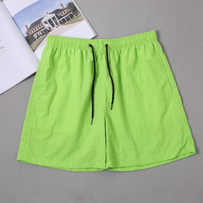 China Custom QUICK DRY Logo Mens Boardshorts Summer Swimwear Solid Color Casual Swim Trunks Beach Shorts for sale