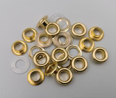 China Customized Fashion 8mmm Round Grommets Fancy Gold Nickel Free Brass Grommets for sale