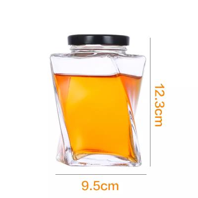 China Vodka Storage Glass Jar with 330ml Capacity and Metal Cover for sale