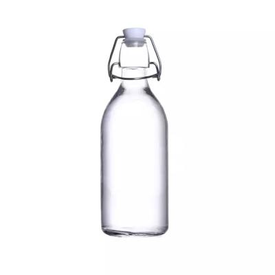 China Round 600ml Glass Bottle With Stopper Caps Carafe Swing Top Beer Bottle Kombucha Bottle Beverage for sale