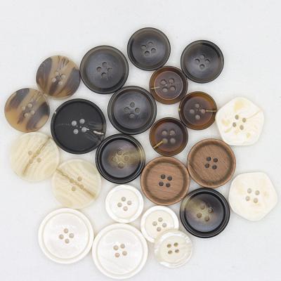 China Viable Wholesale Custom 4 Holes Plastic Garment Buttons Resin Cut Out Button for sale