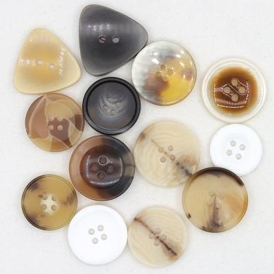 China Factory Customized Viable Resin Plastic Buttons Triangle 4 Hole Suit Jacket Fancy Imitation Horn Sewing Buttons for sale